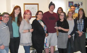 Staff and service users at Reuben court on receiving their Enrich award